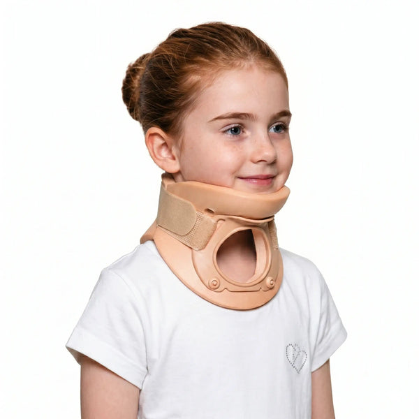 Young girl wearing a beige neck brace on a white background