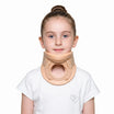 Young girl wearing a beige neck brace on a white background