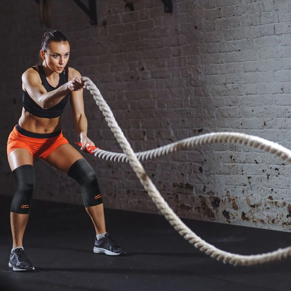 Neon orange Air knee cap in action providing joint support and stability during movement