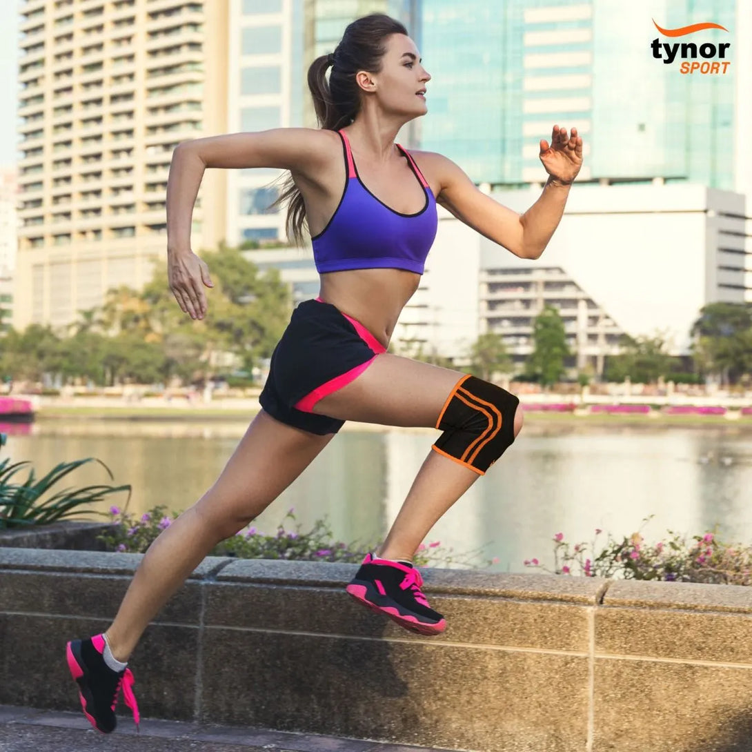 Neo neon orange knee cap shown in use, providing joint support during active movement or sports