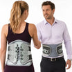 Two people wearing tynor back support belts on a white background