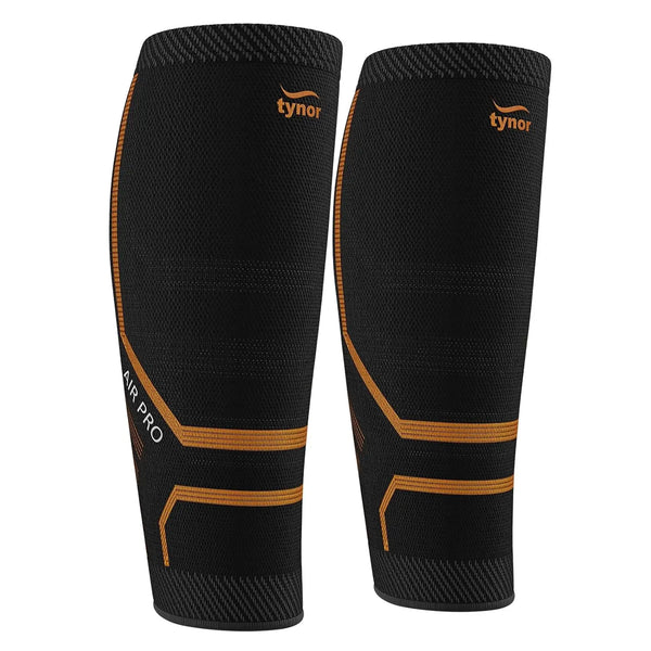 Pair of Tynor black and orange calf sleeves providing compression and muscle support