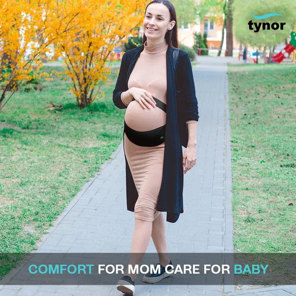 Pregnant woman walking outdoors with a Tynor branded image